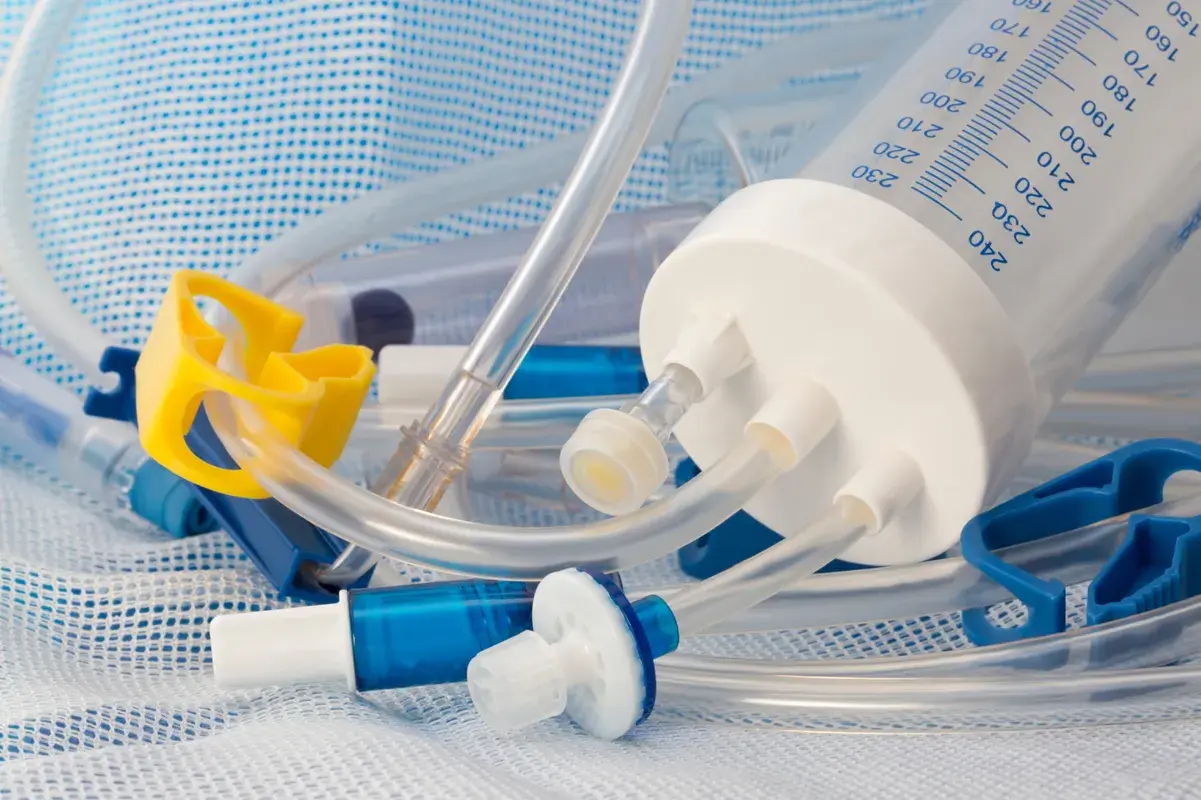 Intravenous tubes and cylinder on a sterile mesh