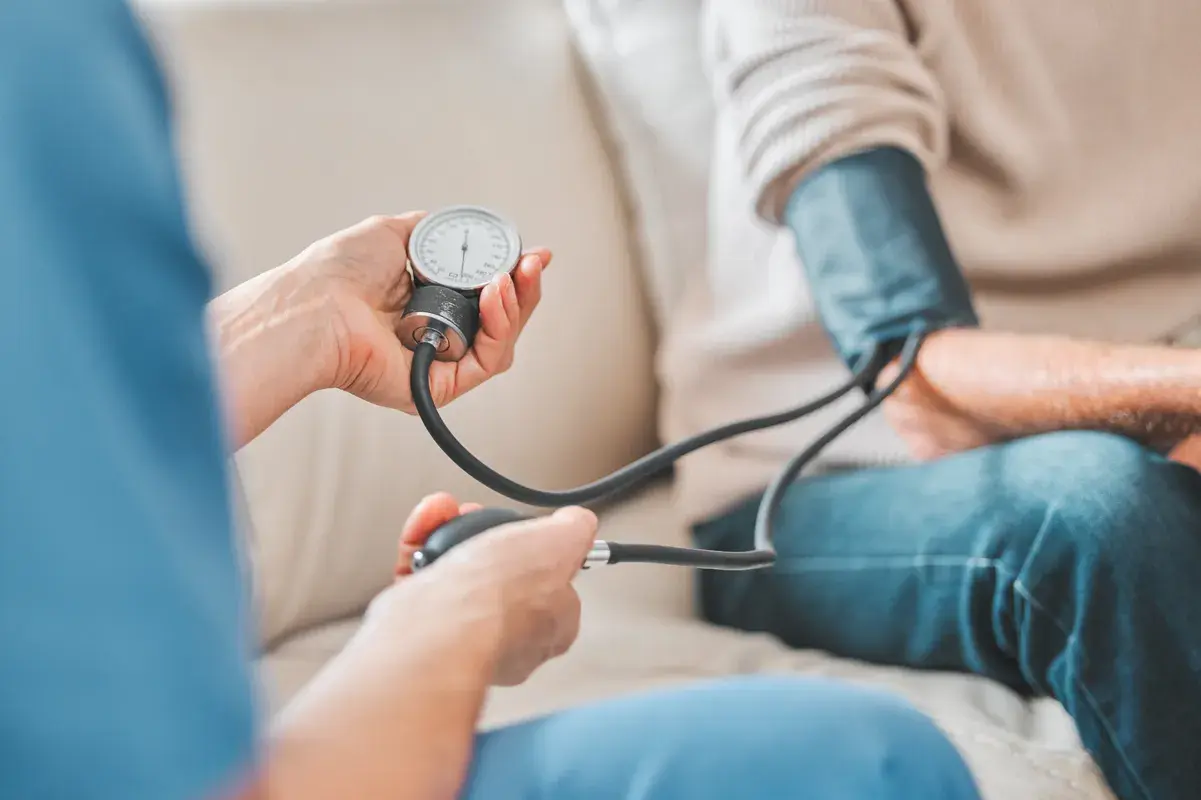 Patient taking blood pressure test for hypertension