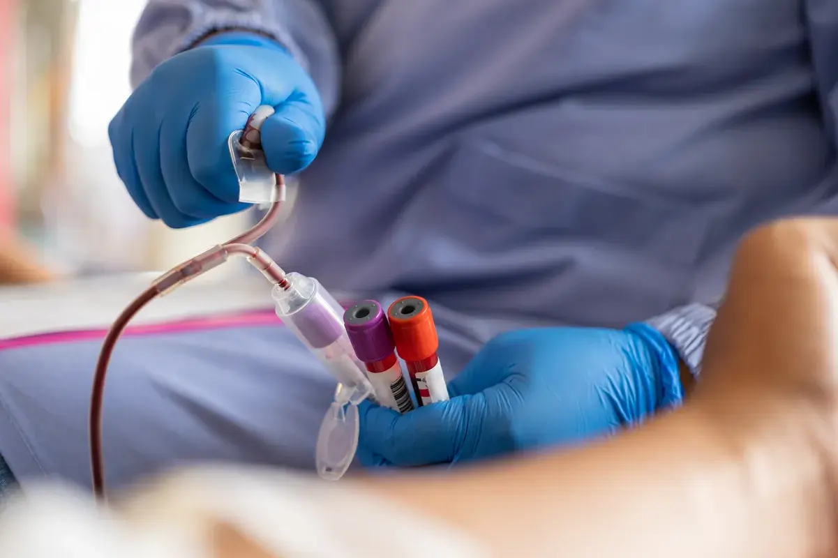 Nurse drawing blood sample